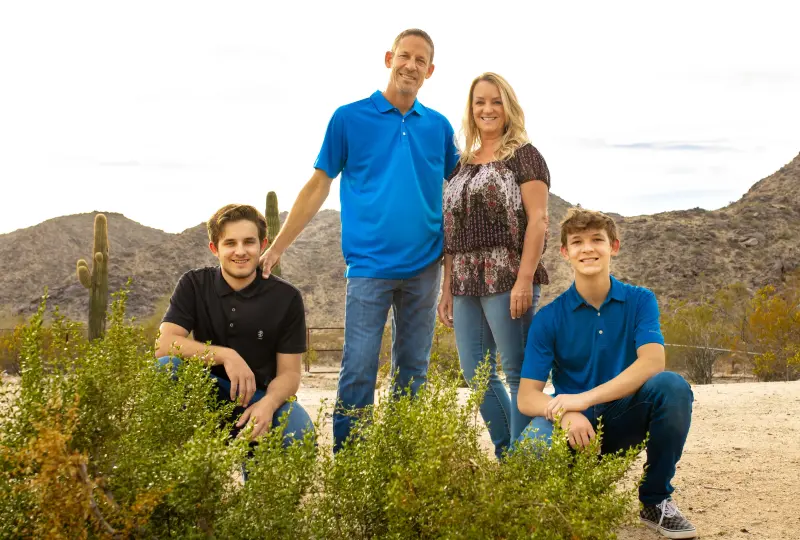 ggg 07 Family posing in desert landscape with cacti.