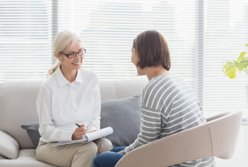 Therapist and client having a conversation.