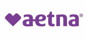 Logo with the word 'aetna' in purple lowercase letters.